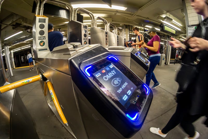 Commuters use OMNY to enter the East 23rd Street station in Manhattan