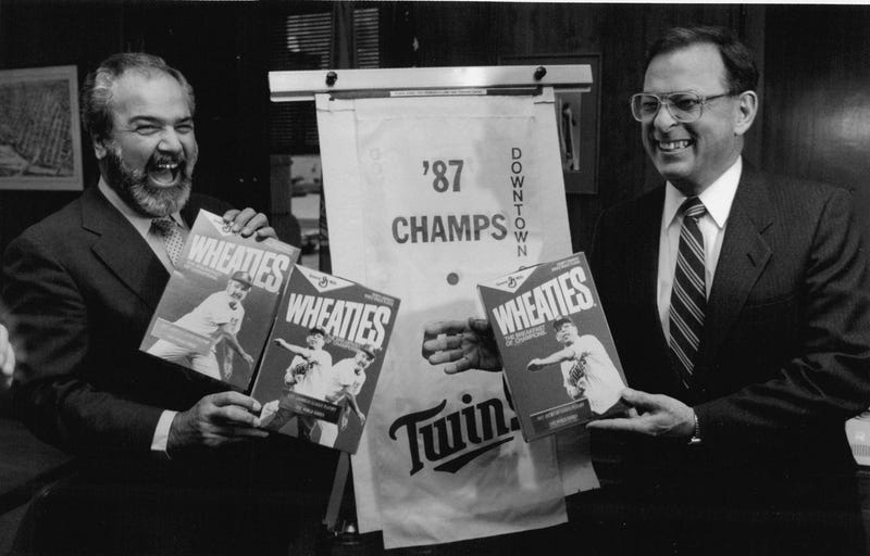 October 14, 1987: Twin Cities mayors George Latimer of St. Paul (1) and Donald Fraser of Minneapolis chuckle after being presented commemorative Wheaties boxes with their pictures emblazoned on them. 