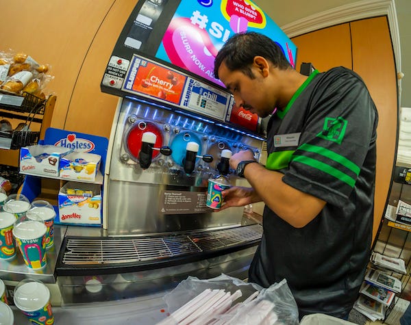 A worker fills a Slurpee in a 7-Eleven store in New York on Thursday, July 11, 2019