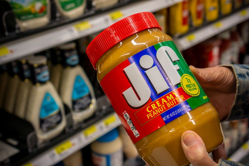 A shopper chooses a jar of the J.M. Smucker Co. Jif brand peanut butter in a supermarket in New York on Tuesday, August 27, 2019. 