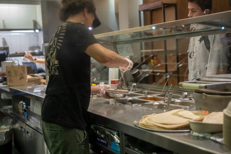 A worker prepares a meal at a Chipotle in New York City