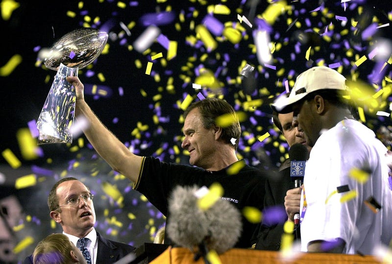 Brian Billick holds up the Lombardi Trophy following the Ravens 34-7 victory over the New York Giants in Super Bowl 35.