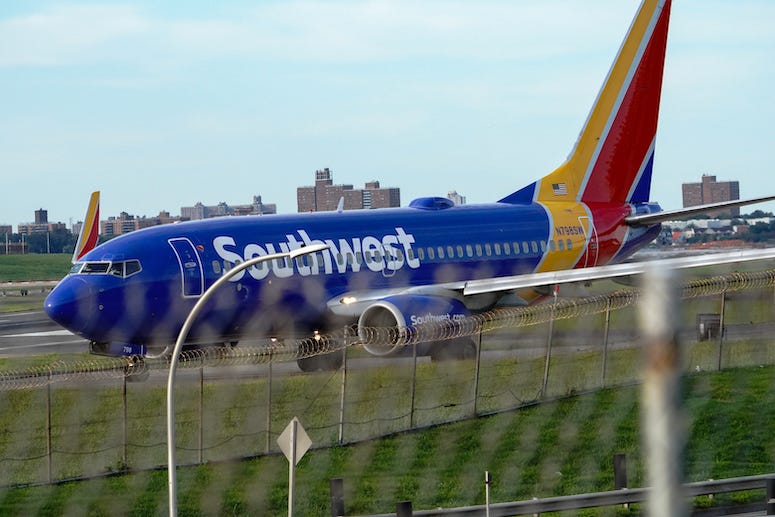 Southwest Airlines plane behind fence
