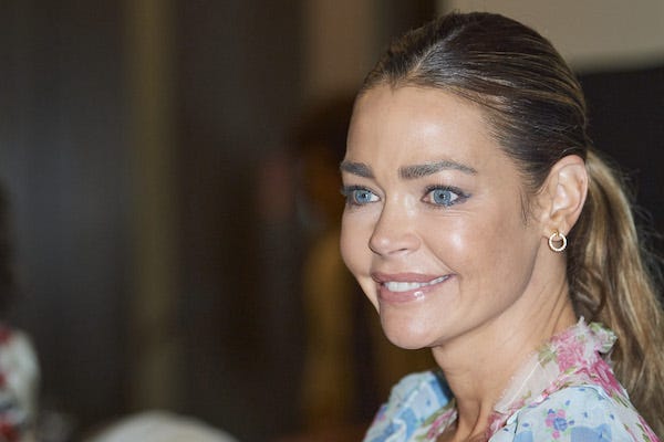 Denise Richards attends 'Glow and Darkness' photocall at Palace Hotel in Madrid, Spain
