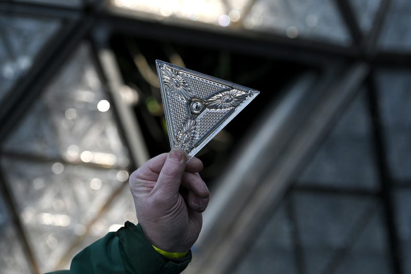 Landmark electricians Chris Sisti holds up one of 192 Waterford crystals triangles that will be placed onto a panel that will be added to the Times Square New Year’s Eve ball, New York, NY, December 27, 2020.