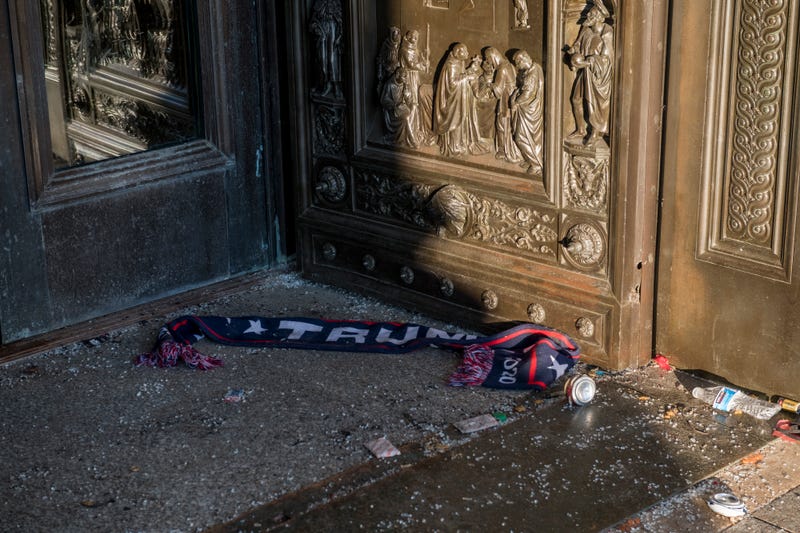 Items left on the floor at the entrance of the U.S. Capitol in the aftermath the morning after a riot by pro-Trump supporters who stormed and vandalized the U.S. Capitol as Electoral votes were being counted during a joint session of the United States Congress to certify the results of the 2020 presidential election. Washington, DC, Thursday, January 7, 2020
