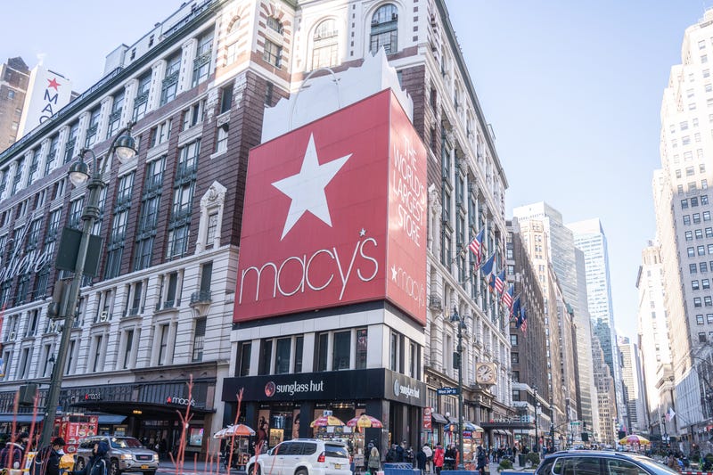 Pedestrians walk pass the Macy's Herald Square flagship store on 34th Street in Midtown Manhattan