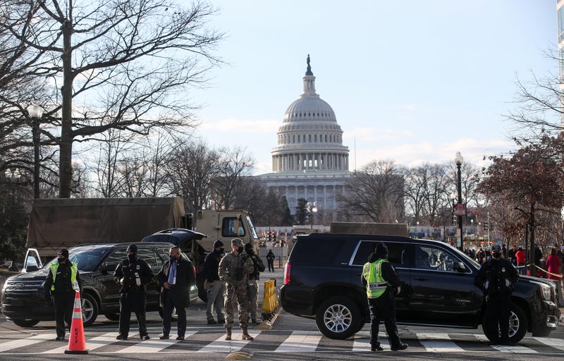 File photo: US National Guardsmen and police officers stand on a closed street outside the Capitol Building ahead of the inauguration