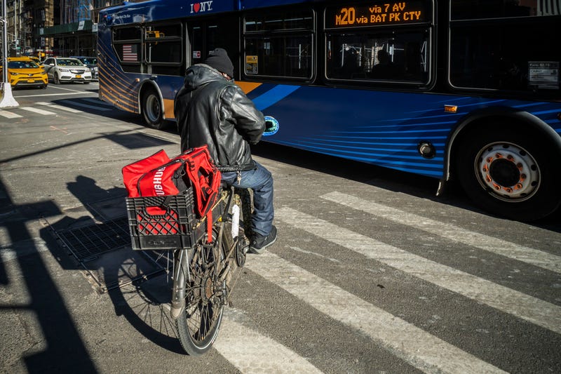 A GrubHub delivery worker in the Chelsea neighborhood in New York on Saturday, January 30, 2021