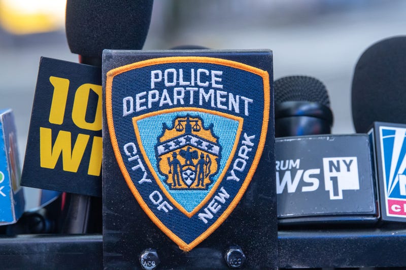 A New York City Police Department (NYPD) badge seen on a podium in Times Square. 