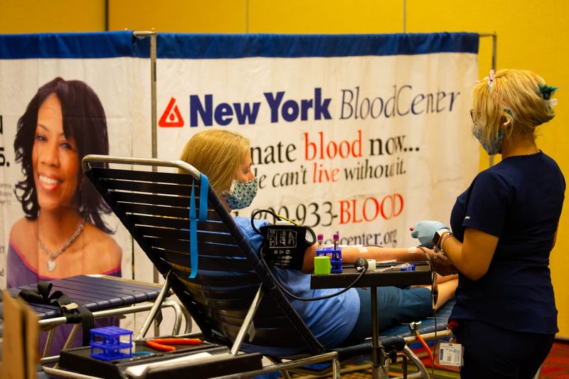 File photo: A donor specialist takes blood from a donor, at an emergency blood drive hosted by the New York Blood Center and the New York Islanders on World Blood Donor Day in Uniondale, New York, on June 14, 2021