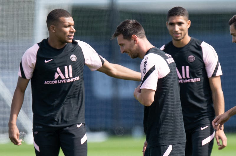 Paris Saint-Germain's French forward Kylian Mbappe and Argentinian forward Lionel Messi attend a training session at the Camp des Loges Paris Saint-Germain football club's training ground in Saint-Germain-en-Laye, near Paris, France on August 13, 2021.