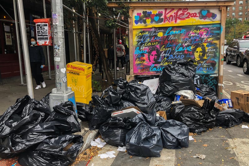 Garbage bags pile up at the corner of Avenue A and 13th Street in the East Village on Oct. 24, 2021