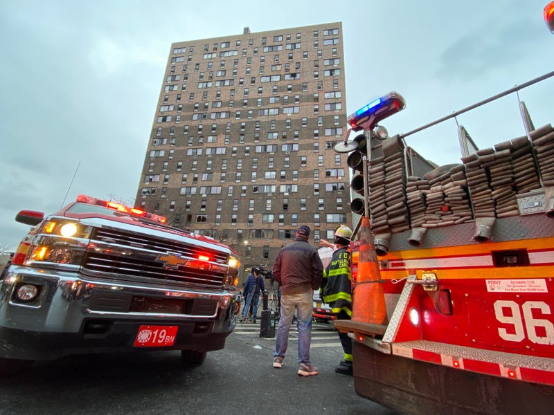 People at the scene of an apartment fire in the Bronx on Jan. 9, 2022