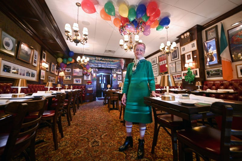 Mary O’Connor, manager of Neary’s Irish pub and restaurant, looks after decorations for upcoming St. Patrick’s Day celebrations, New York, NY, March 16, 2022
