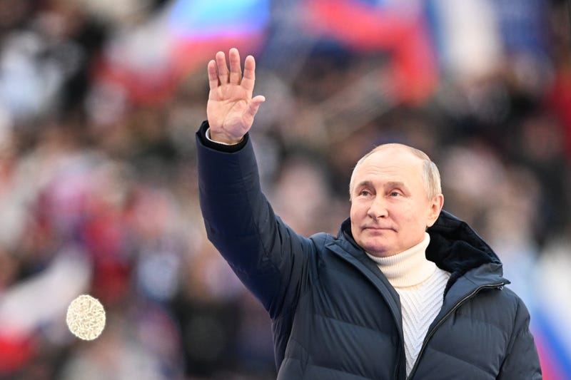 Russia's President Vladimir Putin attends a concert titled Crimean Spring held at Luzhniki Stadium to mark the 8th anniversary of the reunification of Crimea with Russia