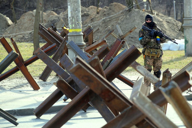 An armed Territorial Defence soldier stands guard at a roadblock in Kyiv, Ukraine, on March 28, 2022