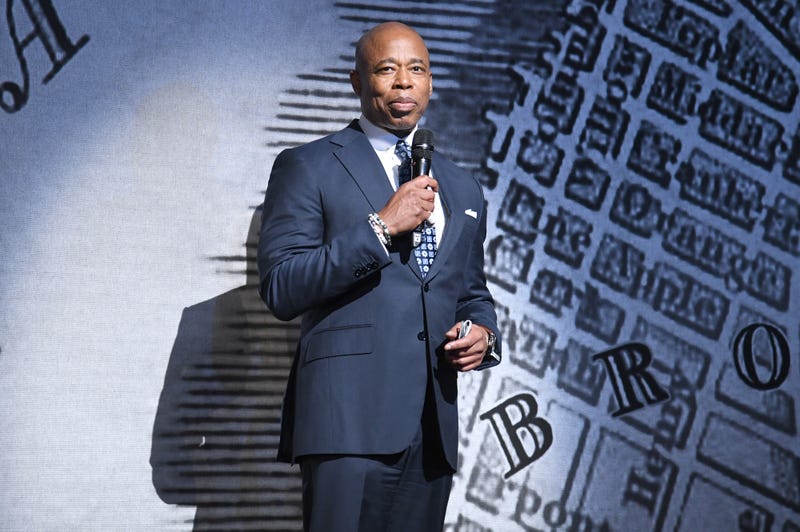 Mayor Eric Adams makes remarks on stage before the start of opening night for the musical “Paradise Square” on Broadway, at the Barrymore Theatre in Times Square on April 3, 2022