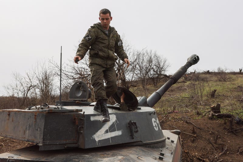 A serviceman of the LPR People's Militia is seen on a 2S1 Gvozdika self-propelled howitzer in the city of Pervomaisk on April 10, 2022