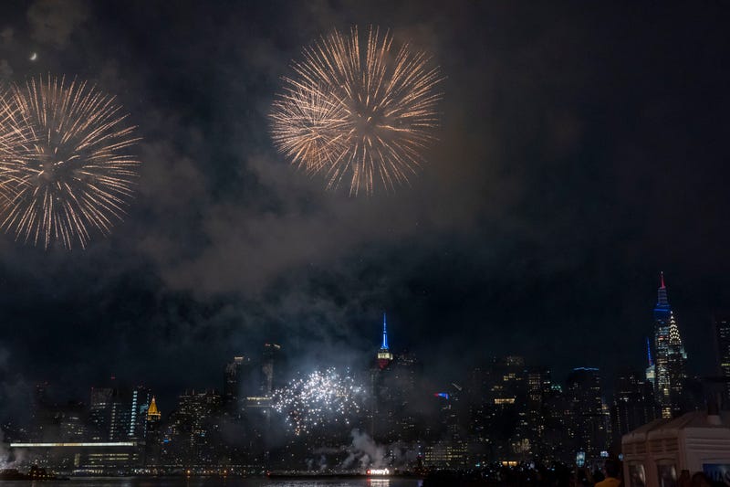 Fireworks explode over the East River during the 46th annual Macy's 4th of July Fireworks Display overlooking the Empire State Building, Chrysler Building, and the Manhattan skyline at Gantry State Plaza in Long Island City, in the Queens borough of New York City.