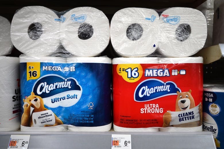 Rolls of Charmin toilet paper on display