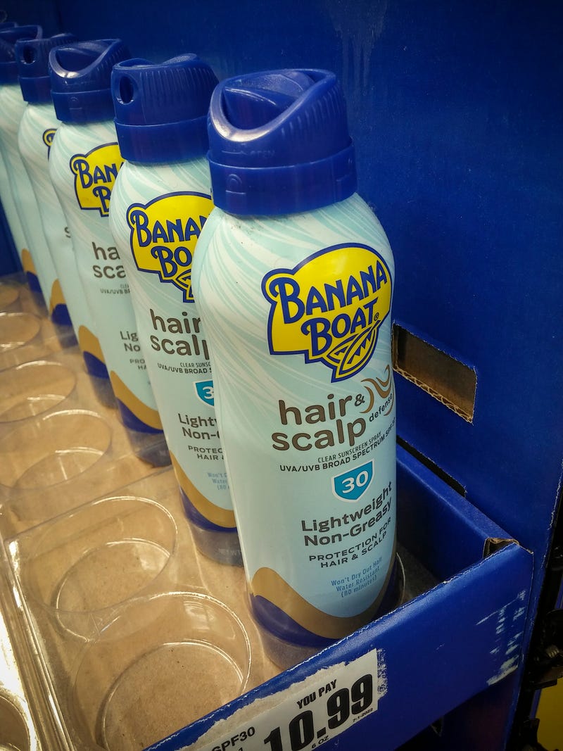 Bottles of Banana Boat brand Hair and Scalp Sunscreen Spray SPF 30 are seen on a store shelf in New York on Sunday, July 31, 2022. 