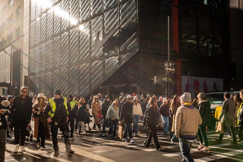 People fill the streets of Midtown Manhattan on Dec. 4, 2022