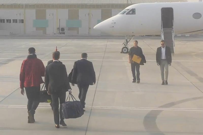Brittney Griner (far left) at an air base in the United Arab Emirates on Dec. 8, 2022. A U.S.-Russia prisoner swap was made at the base. Russia received arms dealer Viktor Bout (second from right)