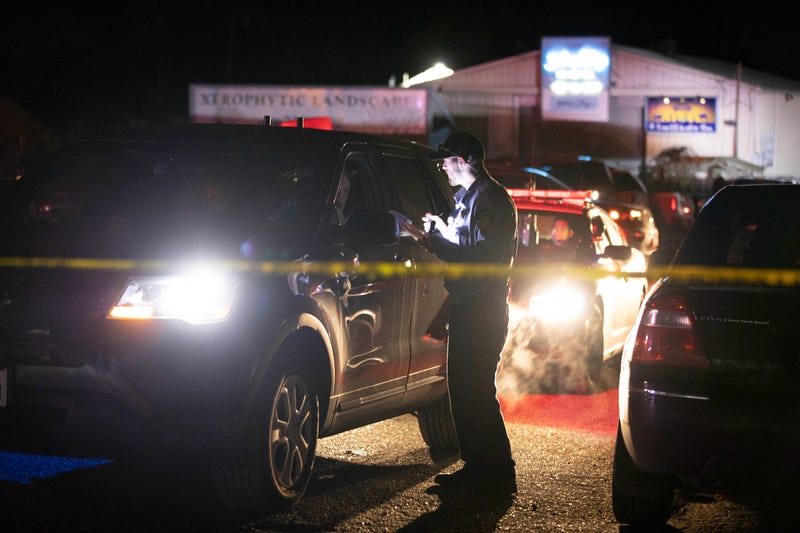 Law enforcement officials work at the scene of a shooting on January 23, 2023 in Half Moon Bay, California. Seven people were killed at two separate farm locations that were only a few miles apart.