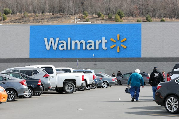 A Walmart logo seen from the parking lot of its store in Bloomsburg