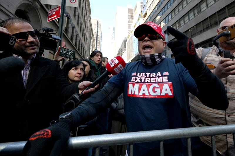 Trump supporters speak out in front of the press outside Trump Tower in New York, NY, on April 3, 2023.