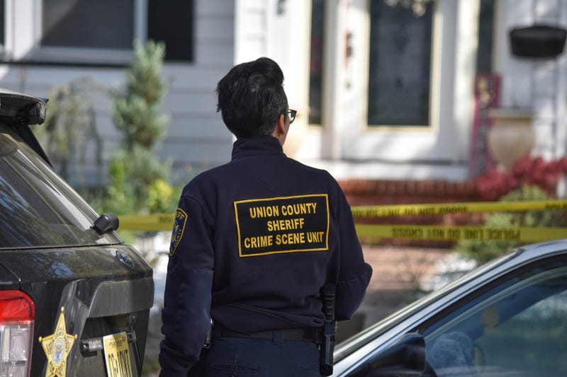 Officers at the scene of the crime on Thursday.