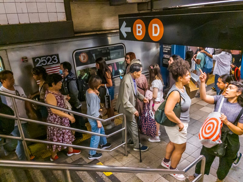 Subway riders crowd the Broadway–Lafayette Street station in SoHo in May