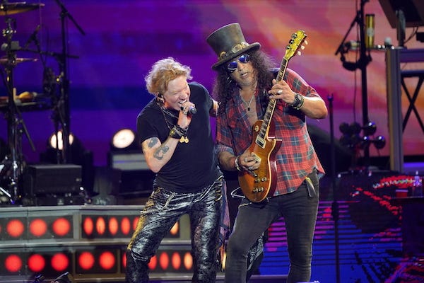 Axl Rose and Slash of Guns N' Roses performing on the Pyramid Stage at the Glastonbury Festival at Worthy Farm in Somerset