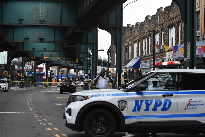 Police block the roadway where an 86-year-old man was fatally shot on Saturday in Richmond Hill
