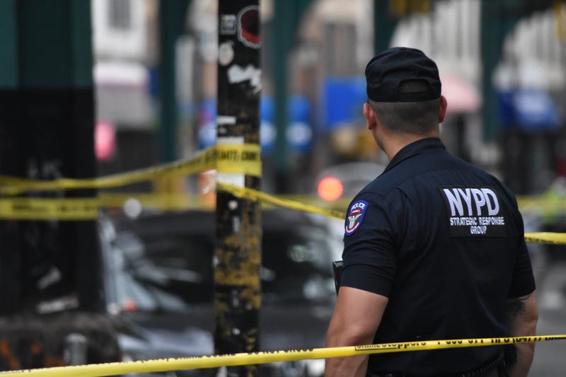 Police block the roadway where an 86-year-old man was fatally shot on Saturday in Richmond Hill
