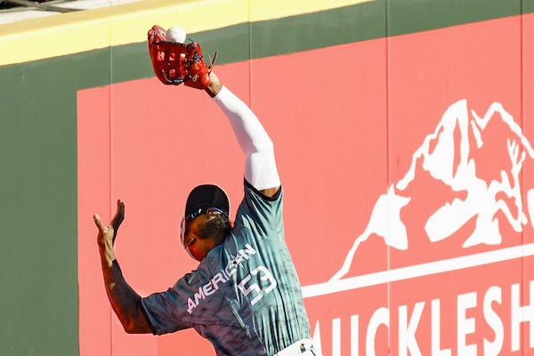 Adolis Garcia of the Texas Rangers catches the fly ball hit by Sean Murphy of the Atlanta Braves in the fourth inning of Major League Baseball's All-Star Game at T-Mobile Park in Seattle on July 11, 2023