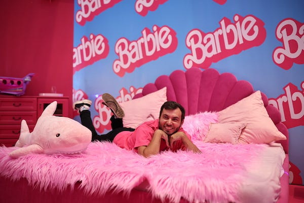 A man poses for a photograph at the Moscow premiere of the 2023 comedy film Barbie at the Mori Cinema at Moscow's Kuntsevo Plaza shopping mall