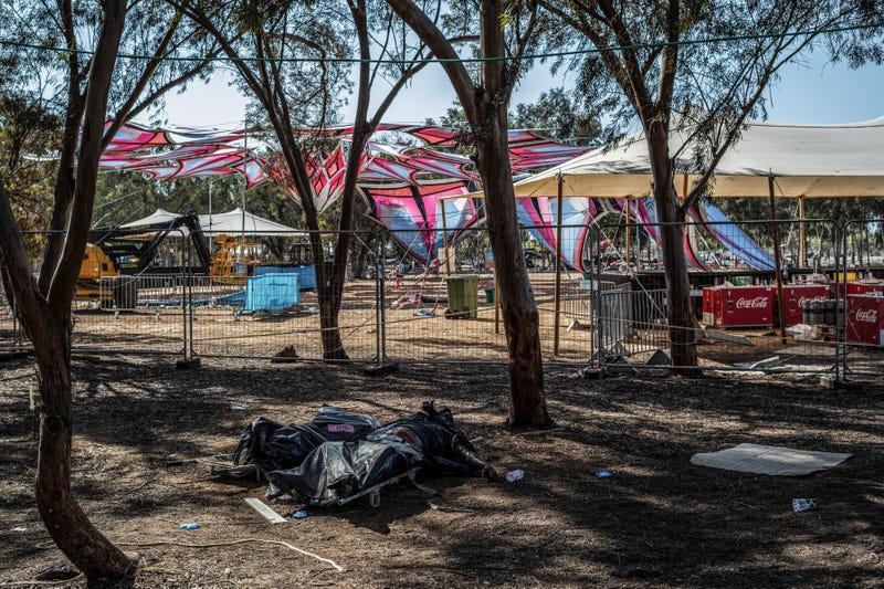 Covered bodies of Hamas militants were seen at the site of the Supernova desert music festival, Oct. 12, 2023, after Israeli forces secured areas around Re'im, Israel.