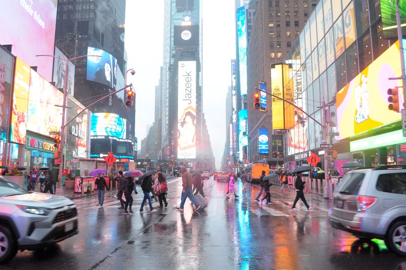 Pedestrians walk through Times Square in March, when twice the average amount of rain fell in the city
