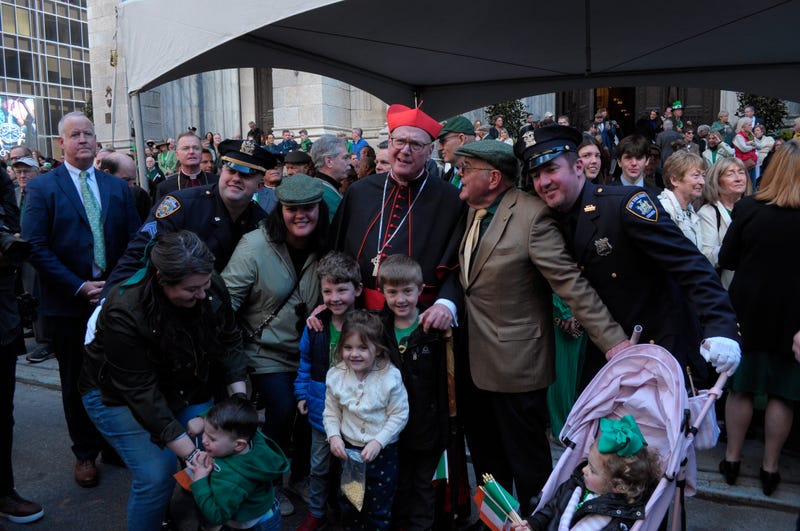 Cardinal Timothy Dolan takes a photo at the New York City St. Patrick's Day Parade in 2024