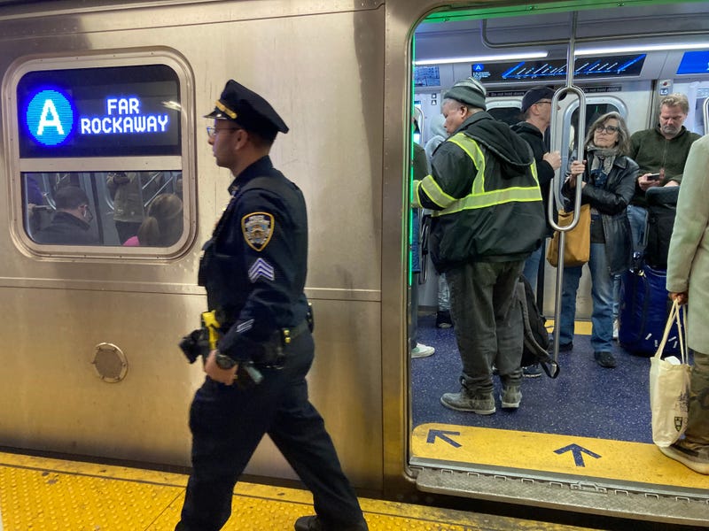 An officer patrols the platform along the A line
