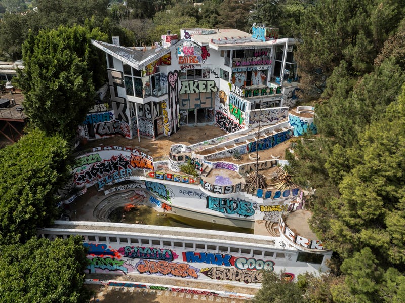 Squatters have taken over an abandoned multimillion-dollar Hollywood Hills mansion, owned by movie producer John Powers Middleton. Taggers have recently covered the mansion with graffiti.
