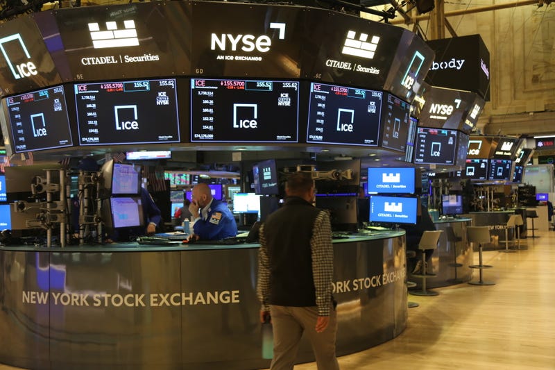 A trader walks on the trading floor of the New York Stock Exchange in New York, on Nov. 6, 2024. U.S. stocks surged to record highs on Wednesday following Republican Donald Trump's victory in the 2024 presidential election.
