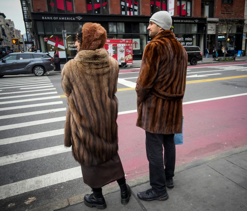 People stay warm in the Flatiron District