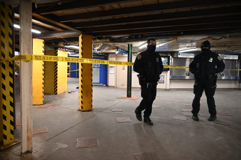 NYPD officers are seen at the scene of a stabbing at the 61st Street station in Woodside on Dec. 22, 2024