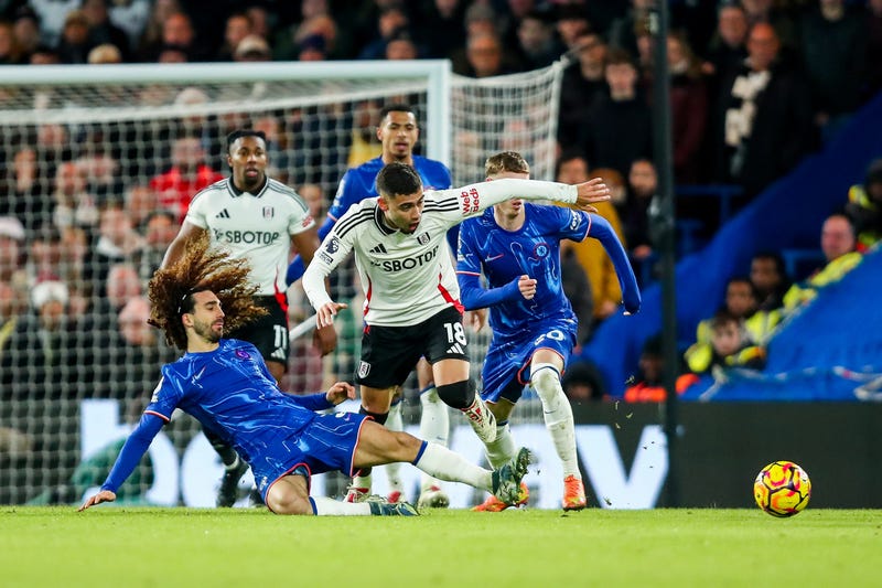 Andreas Pereira of Fulham F.C. is challenged by Marc Cucurella of Chelsea F.C. during their Premier League match at Stamford Bridge, London, on Thursday.