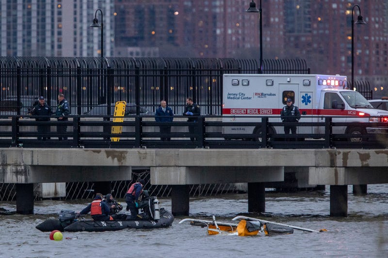 The crashed helicopter is seen in the Hudson River during recovery operations on April 10, 2025