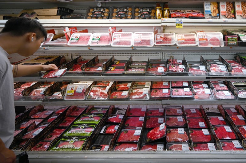 A shopper looks at prices in the meat section of a supermarket on July 21, 2025. Price of beef has risen almost 9% since January according to the Department of Agriculture, with steak up more than 12% and ground beef up more than 10%. 