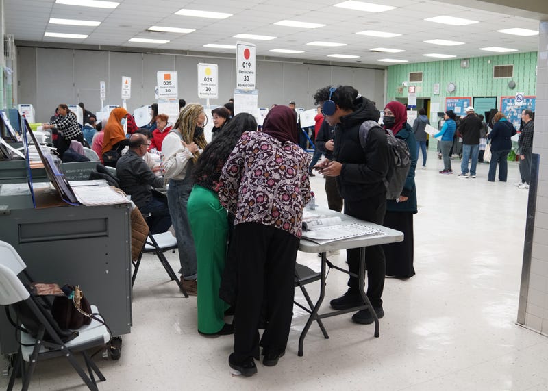 People vote inside a polling station in Queens on Nov. 4, 2025